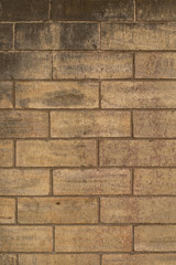 Golden textured brick wall