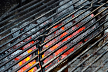 Detail of the barbecue grill with blurry embers