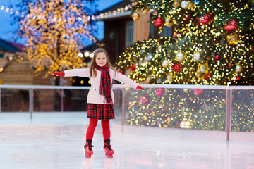 Kids ice skating in winter. Ice skates for child.