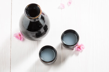 Top view of traditional sake in old black ceramics
