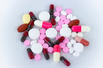 Medicine concept; Assorted pharmaceutical medicine pills, tablets and capsules with white background.