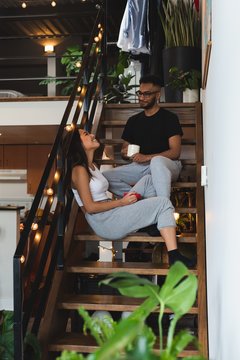 Couple talking with each other on steps