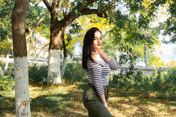 Autumn woman portrait outdoors at the park