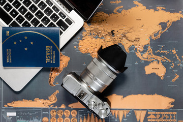 Travel planning with camera and Brazilian passport.
