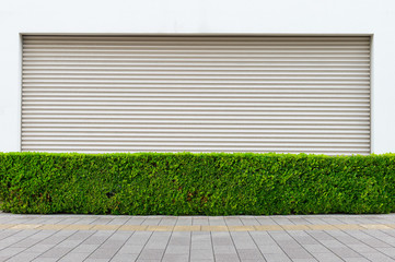 A closeup shot of automatic metal roller door used in factory, storage, garage, and industrial...