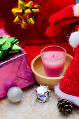 Close up of Pink candle and christmas decoration backgrounds vertical side