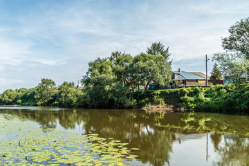 River on a sunny summer day in a village
