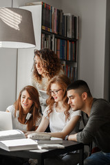 Group of students study in the school campus library.Learning and preparing for university exam.
