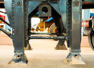 Landing gear on truck. Close up of Landing gear carbon steel on trailer truck or landing legs.  -...