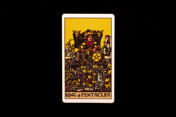 An individual minor arcana tarot card isolated on black background. King of pentacles.