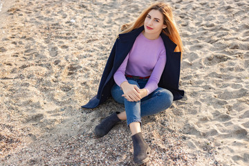 A young girl spends time on the coast