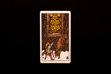 Naklejka na ściany i meble An individual minor arcana tarot card isolated on black background. Five of pentacles.