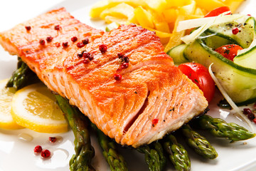 Grilled salmon, French fries and vegetables