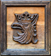 The emblem of the city of Szczecin in Poland. Wooden sculpture. - obrazy, fototapety, plakaty