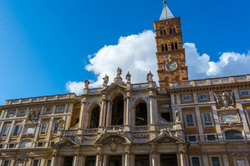 Fototapeta na wymiar The Basilica of Santa Maria Maggiore on Blue Partially Cloudy Sky Background.