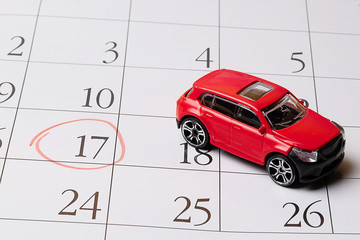 red toy car is located on the calendar, the number 17 is circled in red