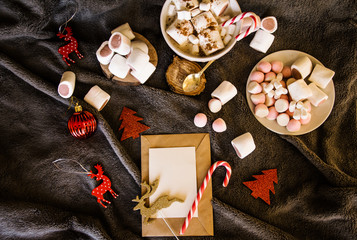 Good New Year spirit. Coffee with marshmallows and cinnamon. Pink mug. Cooking yourself.Home comfort. New Year. Christmas time. Winter mood.Letter to Santa Claus. To Do list.New Year resolution