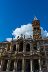 Fototapeta na wymiar The Basilica of Santa Maria Maggiore on Blue Partially Cloudy Sky Background.