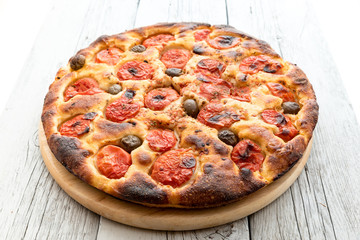 Focaccia typical of Bari Italy with tomatoes and olive