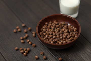 Whole grain Breakfast. Chocolate balls with milk