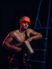 Fototapeta na wymiar For a contractor you can finally relay on. Construction worker or builder. Muscular man at painting work. Skilled painter or decorator man. Worker hold brush roller in muscular hands