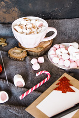 Good New Year spirit. Coffee with marshmallows and cinnamon. Pink mug. Cooking yourself.Home comfort. New Year. Christmas time. Winter mood.Letter to Santa Claus. To Do list.New Year resolution