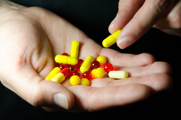 a lot of pills in your hands, keep the pills in your hand