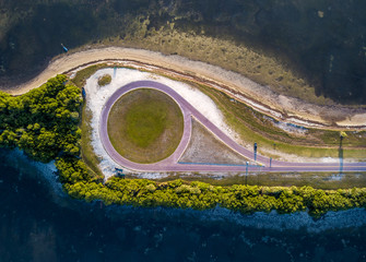 Aerial View of a Circular Roundabout Near a Coast