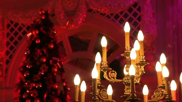 Chandelier and Christmas tree in the palace, defocused futage of  Christmas tree in the banquet hall