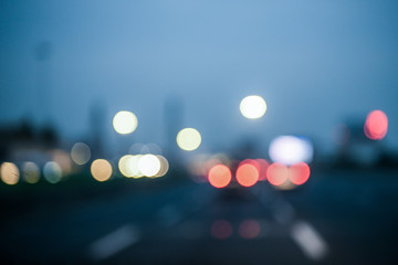 Intentionally blurred multicolored  bokeh city lights background effect. Abstract defocused traffic...