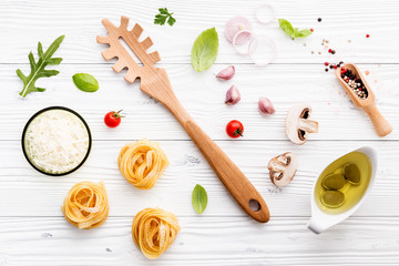 Fototapeta na wymiar Ingredients for homemade pasta on wooden background.