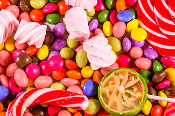 Fototapeta na wymiar Texture of the different candies for background