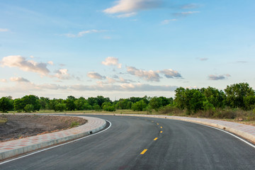 Empty asphalt road curve and clean blue sky in summer day background with copy space