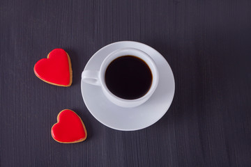 Coffee and a heart shaped cookies, honey, milk and waffles