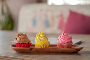 Colorful mix delicious fresh cupcakes