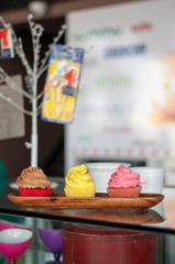 Colorful mix delicious fresh cupcakes