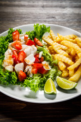 Fried cod and vegetables with french fries