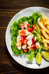 Fried cod and vegetables with french fries