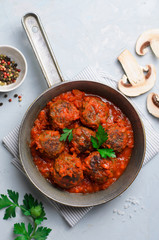 Meatballs in Tomato Sauce in a Frying Pan on Bright Backround