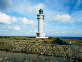 Barbaria Lighthouse at the top of a cliff