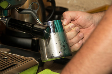 hand holding a cup of coffee