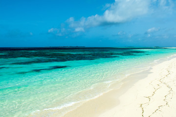Beautiful landscape of clear turquoise Indian ocean, Maldives islands