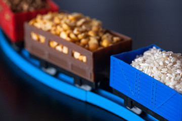 Wagons with grain of rice, peas and buckwheat. Grain Cultures.