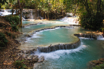 Beautiful and cool azure-colored Kuang Si waterfall near Luang Prabang, Laos