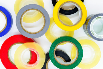 Various colors round adhesive tapes on white background surface