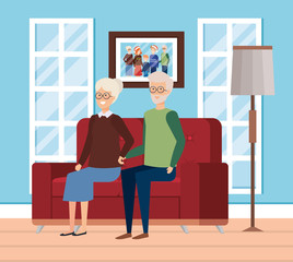 grandparents in livingroom with winter clothes