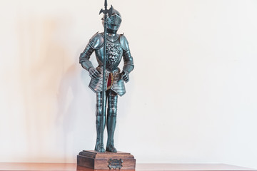 a small bronze decorative figure of a medieval knight