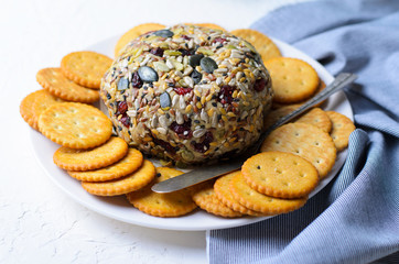 Vegan Cheeseball Appetizer Served with Crackers, Hummus, Nut Butter Spread