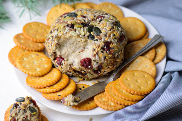 Vegan Cheeseball Appetizer Served with Crackers, Hummus, Nut Butter Spread