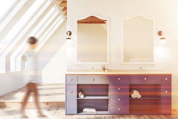 Attic bathroom, blue double sink, woman